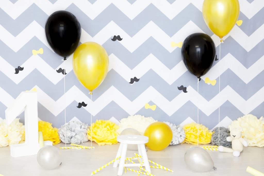 Vibrant first birthday party setup with balloons and festive decor, perfect for celebration themes.
